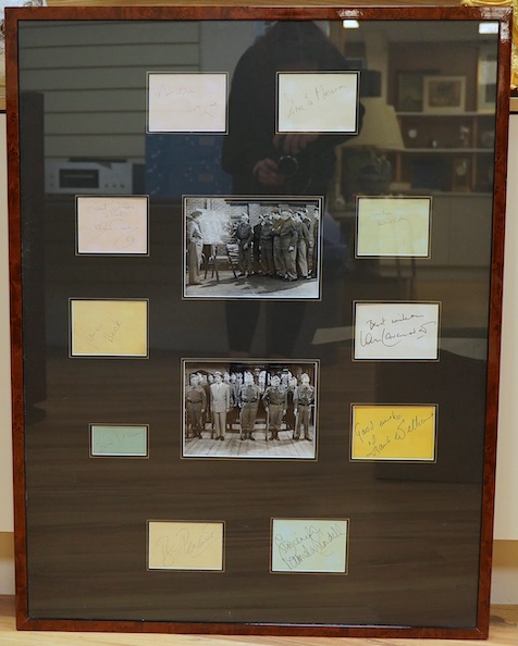 A framed and mounted display of ten autographs from the cast of Dad's Army, together with two photographs, signatures include